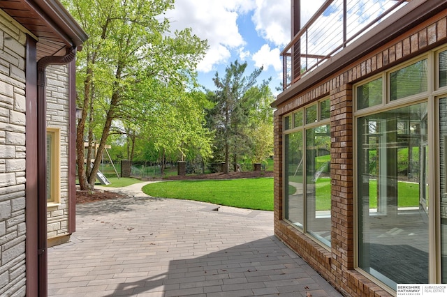 14341 Hamilton St, Omaha, NE 68154 - deck featuring a patio area and a yard