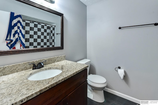 5023 N 96th St, Omaha, NE 68134 - bathroom featuring vanity, curtained shower, and wood finished floors