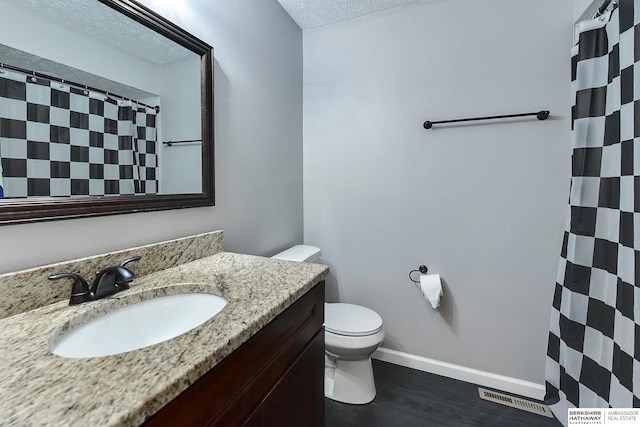 5023 N 96th St, Omaha, NE 68134 - full bath featuring vanity, a textured ceiling, wood finished floors, and a shower with shower curtain
