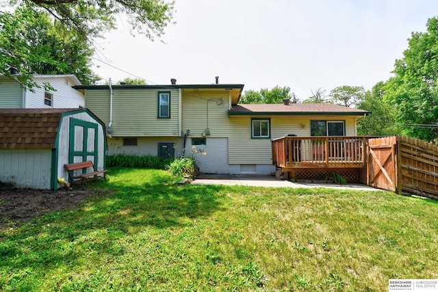 5023 N 96th St, Omaha, NE 68134 - rear view of property with a storage unit and a deck