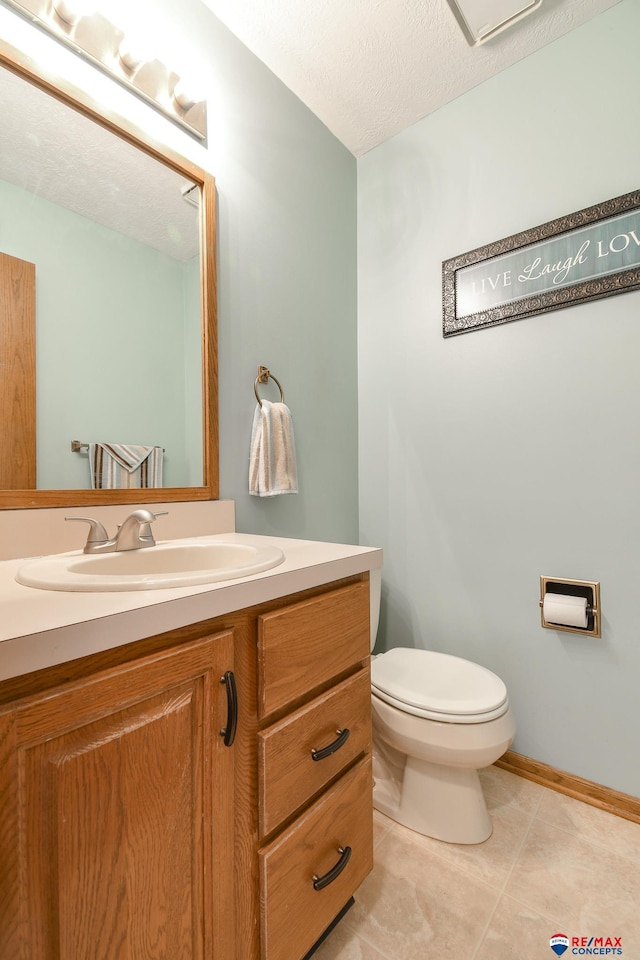 3646 S 77th St, Lincoln, NE 68506 - half bathroom featuring vanity, tile patterned flooring, and a textured ceiling