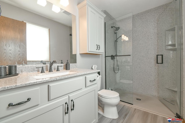 3646 S 77th St, Lincoln, NE 68506 - full bath featuring a tile shower, vanity, and wood finished floors