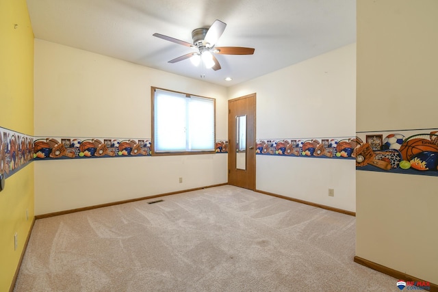 3646 S 77th St, Lincoln, NE 68506 - carpeted spare room featuring ceiling fan and baseboards