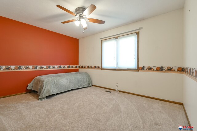 3646 S 77th St, Lincoln, NE 68506 - carpeted bedroom featuring baseboards and ceiling fan