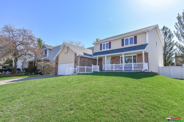 3646 S 77th St, Lincoln, NE 68506 - traditional home with covered porch, driveway, brick siding, and an attached garage