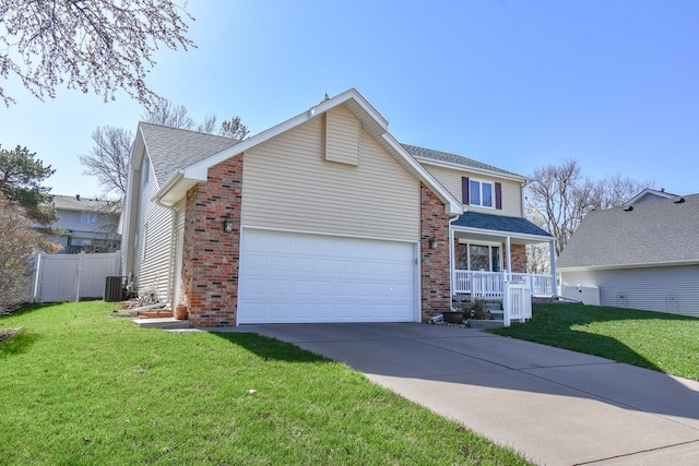 3646 S 77th St, Lincoln, NE 68506 - traditional-style home featuring brick siding, driveway, a garage, a porch, and a shingled roof