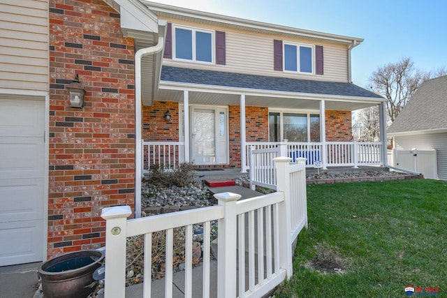 3646 S 77th St, Lincoln, NE 68506 - view of front of home with a porch, brick siding, a front lawn, a garage, and roof with shingles