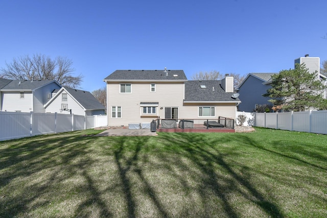 3646 S 77th St, Lincoln, NE 68506 - rear view of property featuring a patio, a fenced backyard, a chimney, and a deck