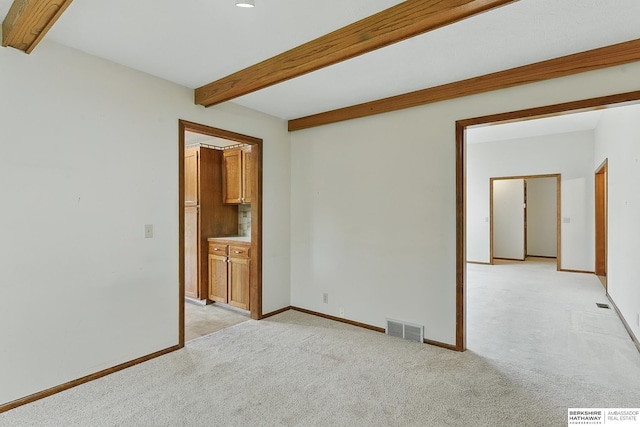 15618 L St, Omaha, NE 68135 - empty room featuring beamed ceiling, light carpet, and recessed lighting