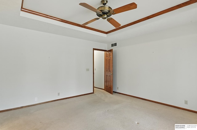 15618 L St, Omaha, NE 68135 - unfurnished room featuring a raised ceiling, light colored carpet, and a ceiling fan