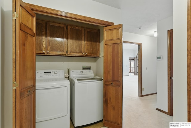 15618 L St, Omaha, NE 68135 - laundry area with washer and clothes dryer, cabinet space, and light colored carpet