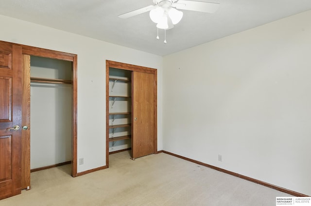 15618 L St, Omaha, NE 68135 - unfurnished bedroom with two closets, light colored carpet, and ceiling fan