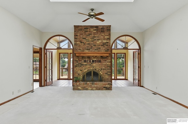 15618 L St, Omaha, NE 68135 - unfurnished living room featuring healthy amount of natural light, a ceiling fan, carpet, and high vaulted ceiling