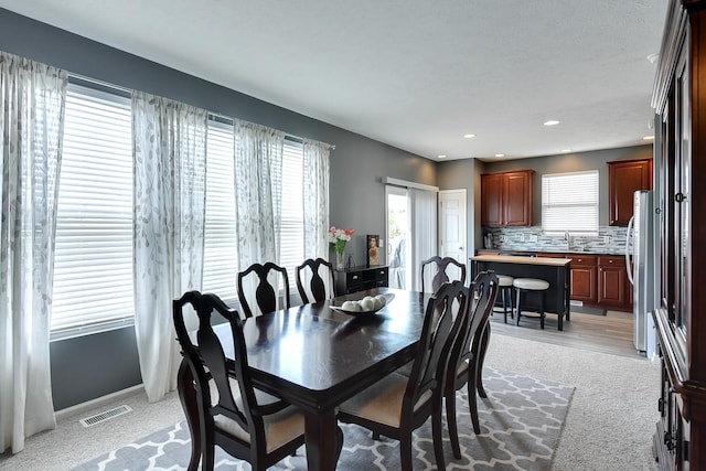 16501 Aurora St, Omaha, NE 68136 - dining area with light colored carpet and recessed lighting