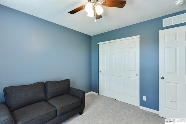 16501 Aurora St, Omaha, NE 68136 - living area featuring a ceiling fan and carpet