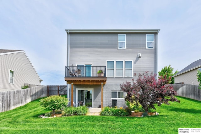 16501 Aurora St, Omaha, NE 68136 - rear view of house with a balcony and a fenced backyard
