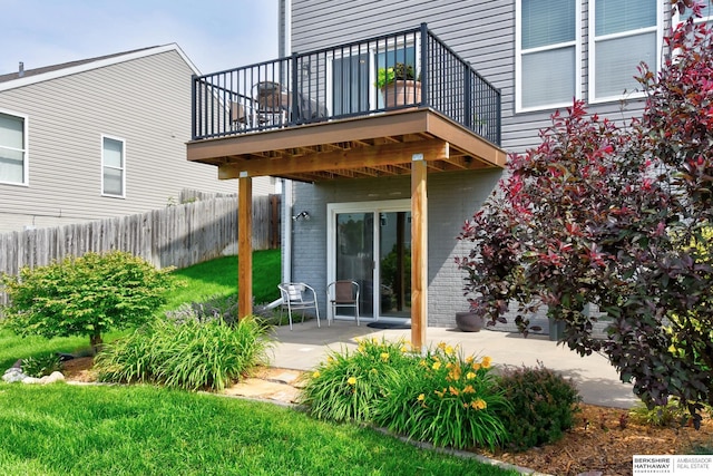 16501 Aurora St, Omaha, NE 68136 - back of property featuring a patio, brick siding, and a balcony