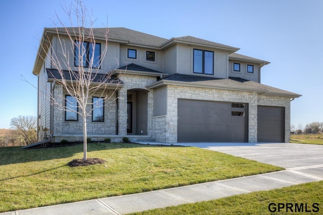 3103 N 184th St, Elkhorn, NE 68022 - prairie-style house with concrete driveway, a garage, stone siding, a front lawn, and roof with shingles