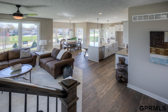 3103 N 184th St, Elkhorn, NE 68022 - living area featuring dark wood-type flooring, a textured ceiling, plenty of natural light, recessed lighting, and a ceiling fan