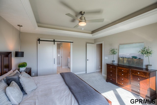 3103 N 184th St, Elkhorn, NE 68022 - bedroom featuring a barn door, a tray ceiling, light colored carpet, ornamental molding, and a ceiling fan