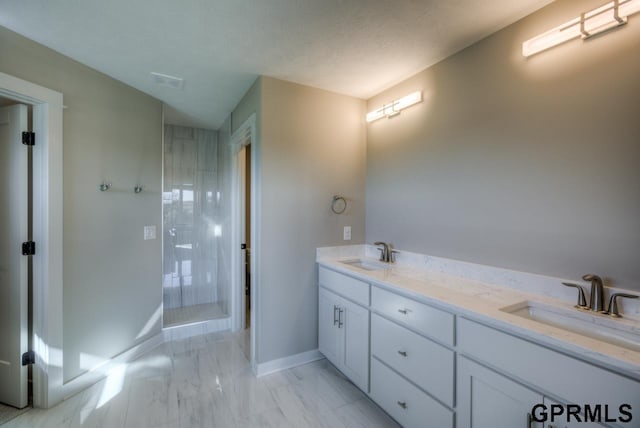 3103 N 184th St, Elkhorn, NE 68022 - bathroom with double vanity, marble look tiles, and a shower stall