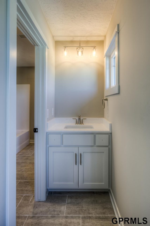 3103 N 184th St, Elkhorn, NE 68022 - bathroom with vanity and a textured ceiling
