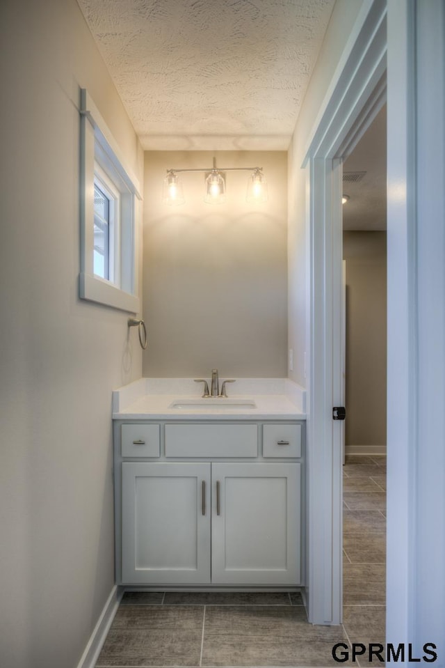 3103 N 184th St, Elkhorn, NE 68022 - bathroom with vanity and a textured ceiling