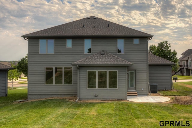 3103 N 184th St, Elkhorn, NE 68022 - rear view of house featuring a patio, a lawn, and roof with shingles