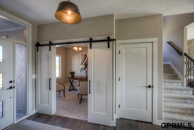 3103 N 184th St, Elkhorn, NE 68022 - entrance foyer with a barn door, dark wood-type flooring, and stairs
