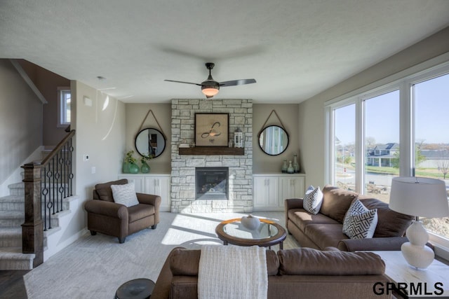 3103 N 184th St, Elkhorn, NE 68022 - living area with healthy amount of natural light, stairway, and a ceiling fan
