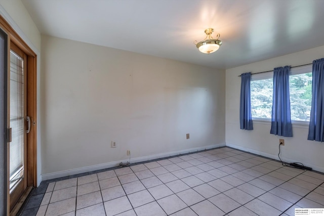 1805 Collins Dr, Bellevue, NE 68005 - spare room with light tile patterned floors and baseboards