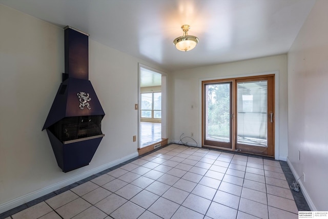 1805 Collins Dr, Bellevue, NE 68005 - unfurnished living room featuring light tile patterned flooring and baseboards