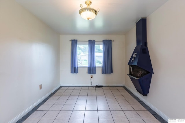 1805 Collins Dr, Bellevue, NE 68005 - empty room featuring baseboards and light tile patterned floors