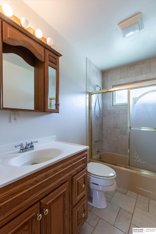 1805 Collins Dr, Bellevue, NE 68005 - bathroom featuring vanity, combined bath / shower with glass door, and tile patterned floors