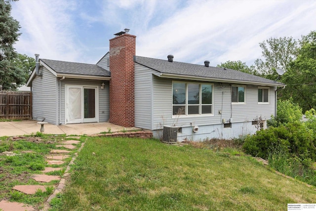 1805 Collins Dr, Bellevue, NE 68005 - rear view of house featuring a patio area, a chimney, and a shingled roof
