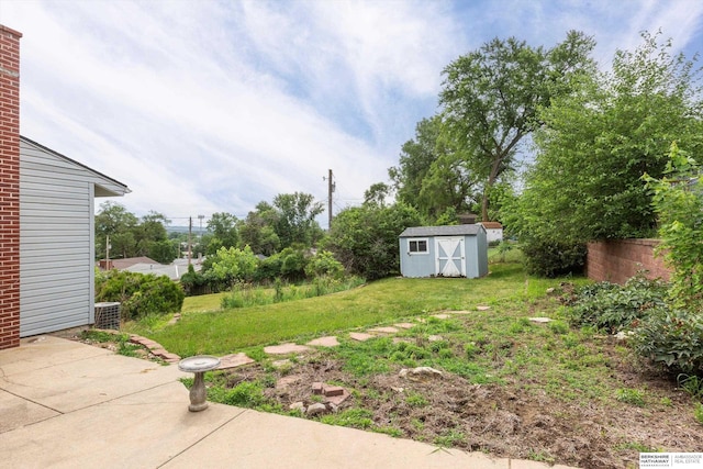 1805 Collins Dr, Bellevue, NE 68005 - view of yard with a patio and a storage shed