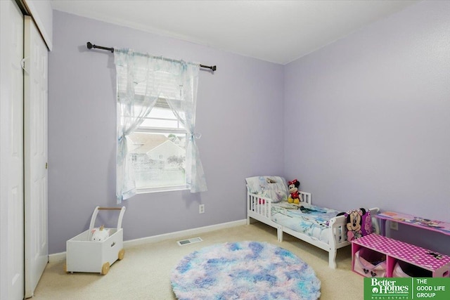8867 Kimball St, Omaha, NE 68122 - carpeted bedroom with baseboards and a closet