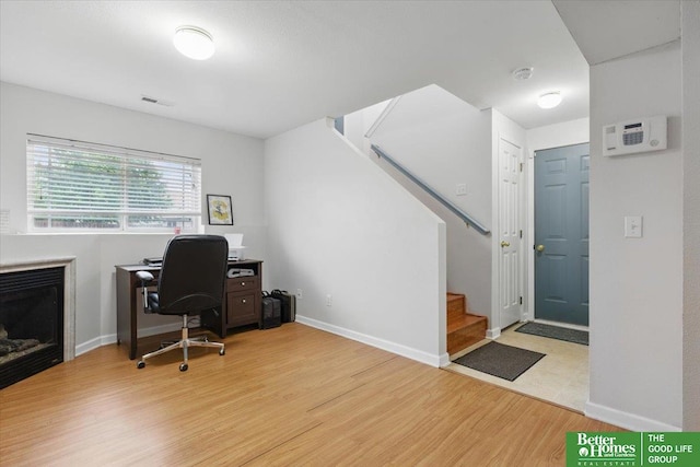 8867 Kimball St, Omaha, NE 68122 - office area with light wood-style floors and a fireplace