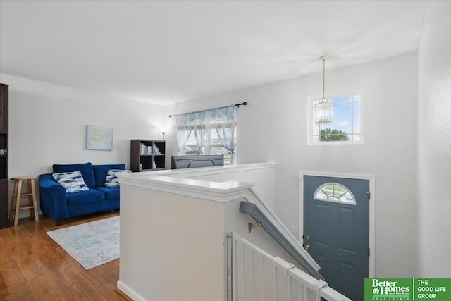8867 Kimball St, Omaha, NE 68122 - foyer featuring dark wood finished floors and a chandelier
