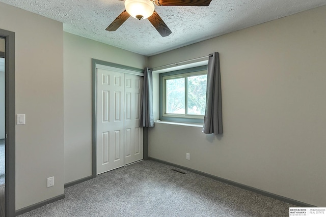 1324 S 162nd St, Omaha, NE 68130 - unfurnished bedroom with carpet floors, a closet, a textured ceiling, and ceiling fan