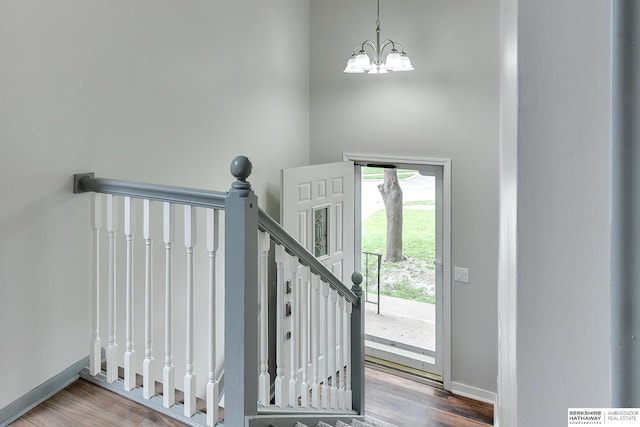 1324 S 162nd St, Omaha, NE 68130 - staircase featuring wood finished floors and a chandelier