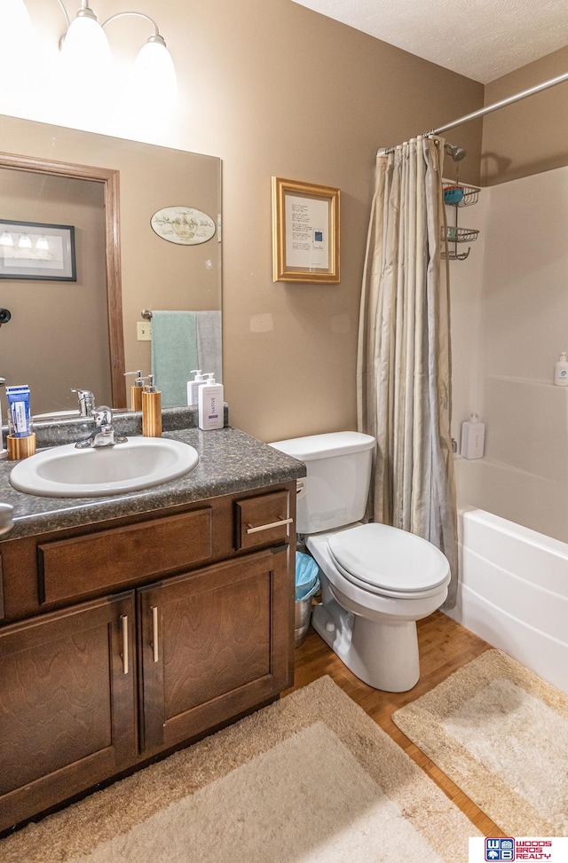 85 Vince Dr, Bennet, NE 68317 - full bathroom with shower / tub combo with curtain, vanity, and wood finished floors