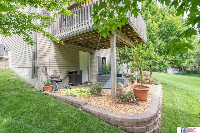 85 Vince Dr, Bennet, NE 68317 - view of grassy yard featuring a deck and a patio area