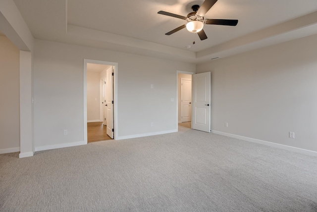 11920 S 109th St, Papillion, NE 68046 - empty room with a tray ceiling, light colored carpet, and a ceiling fan