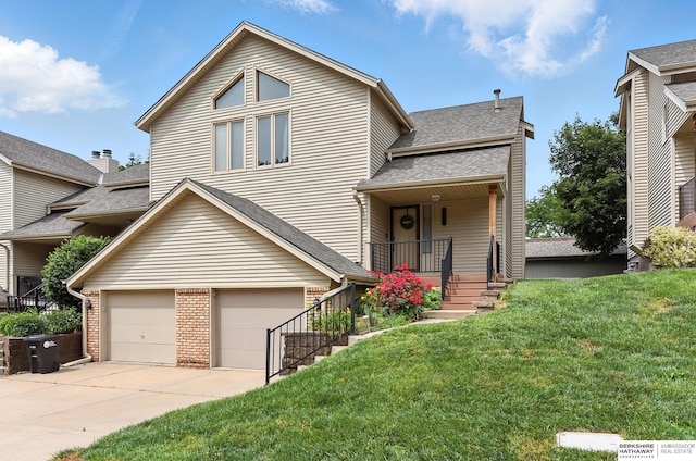2108 S 62nd St, Omaha, NE 68106 - view of front of property with a front yard, driveway, brick siding, an attached garage, and roof with shingles