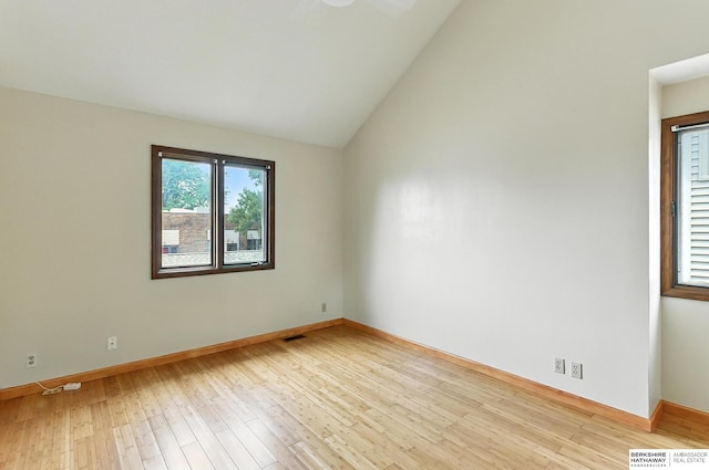 2108 S 62nd St, Omaha, NE 68106 - empty room with wood finished floors and vaulted ceiling