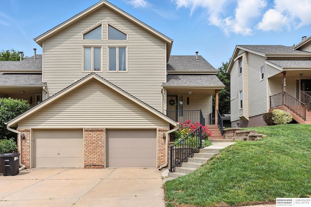 2108 S 62nd St, Omaha, NE 68106 - view of front of property with brick siding, a garage, driveway, and a front yard