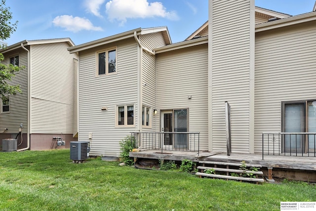 2108 S 62nd St, Omaha, NE 68106 - back of house with a lawn, a wooden deck, and a chimney