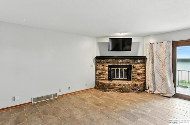 2108 S 62nd St, Omaha, NE 68106 - unfurnished living room featuring a brick fireplace and baseboards
