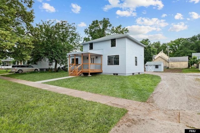316 N 13th St, Tekamah, NE 68061 - view of front of home with dirt driveway, a front yard, and an outbuilding
